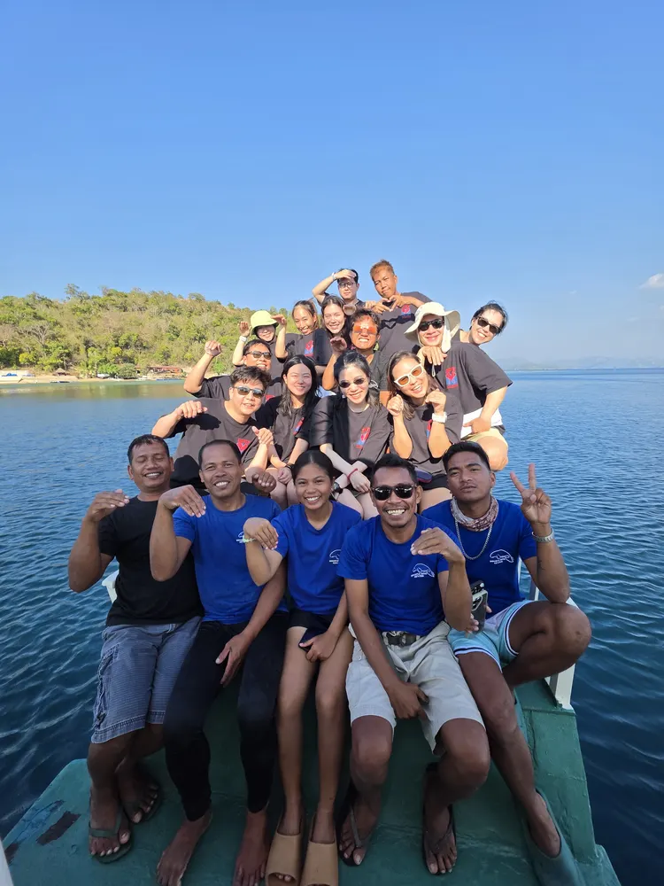 Members on the bow of the liveaboard