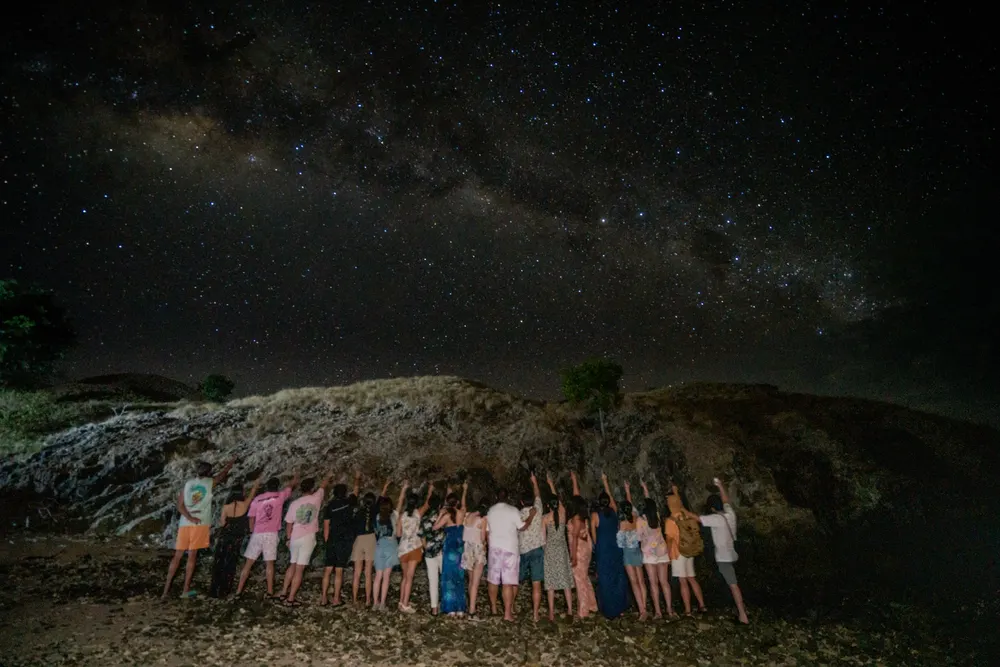 Group under the Milky Way after a night dive